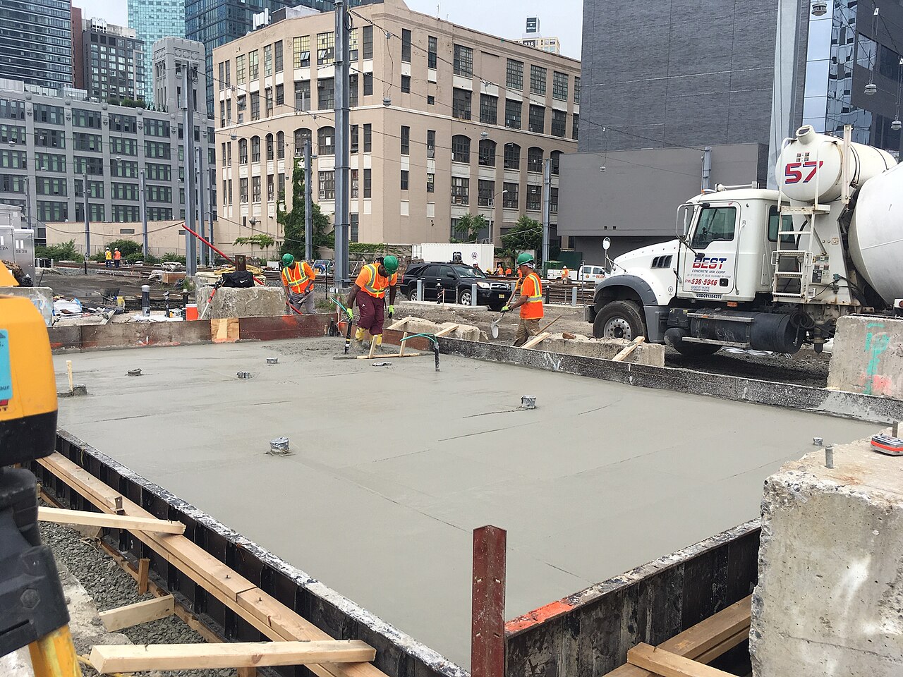 Example of workers finishing a concrete slab
